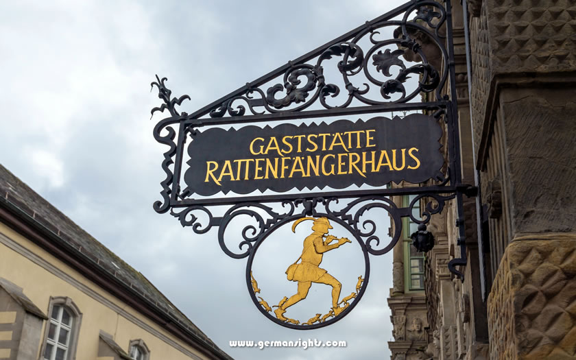 Restaurant sign showing the Pied Piper in Hamelin