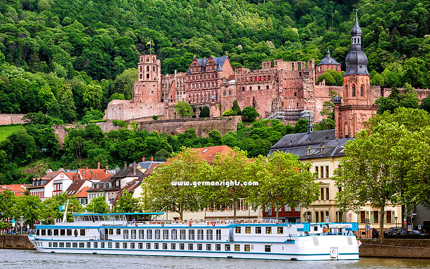 Heidelberg castle and a ferry on the river Neckar in Germany